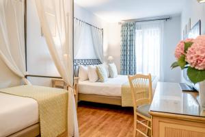 a hotel room with a bed and a window at Villa Alessandra in Paris