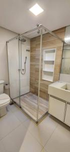 a bathroom with a shower and a toilet at @ondinaapartreservas Pé na Areia 441 in Salvador +37 photos