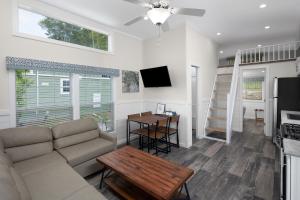 a living room with a couch and a table at Jellystone Park TM Petoskey in Petoskey