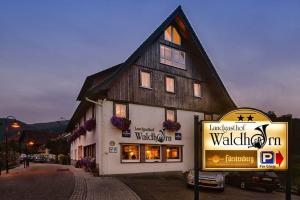 a building with a sign in front of it at Landgasthaus waldhorn in Forbach