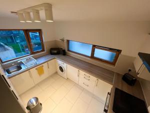 an overhead view of a kitchen with a washer and dryer at Secluded and spacious apartment in Dublin