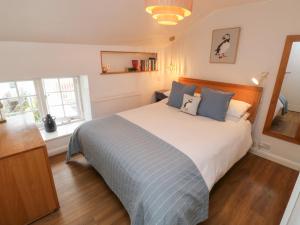 Postel nebo postele na pokoji v ubytování Apple Tree Cottage