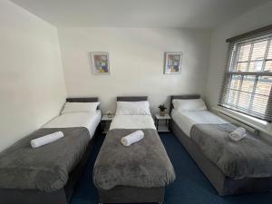 מיטה או מיטות בחדר ב-Kings Central Apartments in Kings Cross
