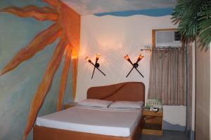 Postel nebo postele na pokoji v ubytování Urban Travellers Hotel