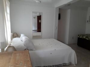 Una cama o camas en una habitación de Vila Shalimar