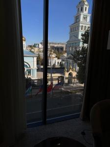 a view of a city from a window at Mir Luxe Plaza in Tashkent
