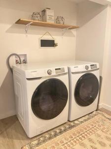 a white washer and dryer in a room at Mid Century Modern Montana Dream Home in Butte