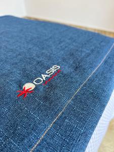 a close up of the word cross on a piece of denim at Pousada Oasis in Pipa