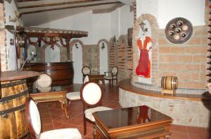 a room with a woman in a dress on a wall at Millenium Palace in Ohrid