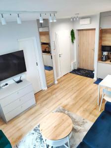 Kuchyň nebo kuchyňský kout v ubytování Apartament MajGraj sąsiedztwo Parku Zdrojowego + 8 fotografií