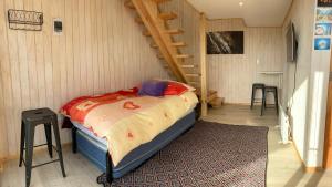 Letto o letti in una camera di Beach escape to Pichilemu - Not so tiny house