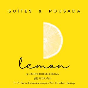a lemon cut in half on a yellow background at Lemon Suítes e Pousada - Indaiá Riviera in Bertioga