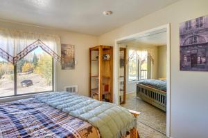 a bedroom with a bed and a window at Cozy Condo with Fireplace - Near Brian Head Resort! in Brian Head