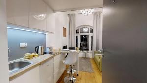 a kitchen with a sink and a counter top at APARTHOTEL TECTUM in Wrocław