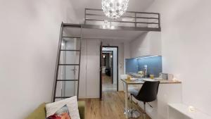 a room with a desk and a loft bed at APARTHOTEL TECTUM in Wrocław +9 photos