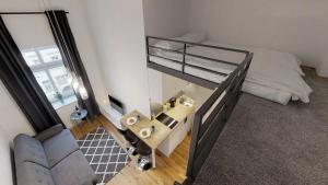 an overhead view of a bedroom with a bunk bed at APARTHOTEL TECTUM in Wrocław