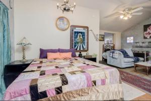a bedroom with a large bed and a living room at Hillmont paradise in Oakland