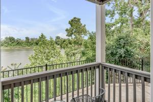 a balcony with a view of the river at Nashville Oasis Walk to Broadway with POOL, Parking, Gym and Patio in Nashville