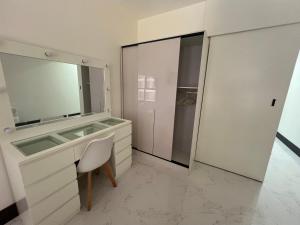 a bathroom with a sink and a mirror at Budget Private Studio with Free Luxurious Pool and Gym by SYM B625 in Phnom Penh
