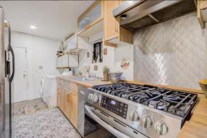 a kitchen with a stainless steel stove top oven at Hillmont paradise in Oakland