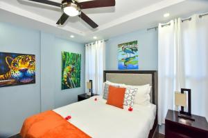 a bedroom with a bed and a ceiling fan at Wagiya Flats in Hopkins