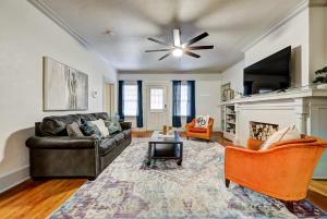 a living room with a couch and a fireplace at Lincoln Lodge B Near OU Med Bricktown Arena in Oklahoma City