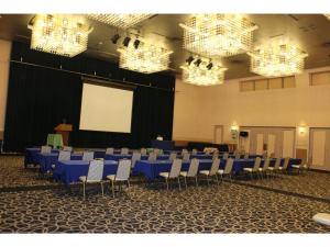 a conference room with blue tables and chairs and chandeliers at Hotel 1-2-3 Maebashi Mercury - Vacation STAY 01042v in Maebashi