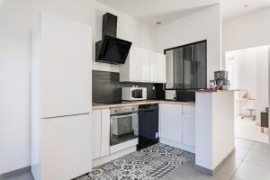 Η κουζίνα ή μικρή κουζίνα στο Superbe appartement cosy avec terrasse +6 φωτογραφίες