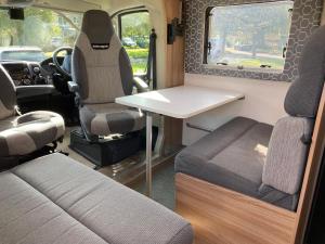 an interior of an rv with a table and chairs at Swift Escape 664 - 4 Berth Motorhome in Kirton