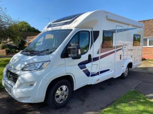 a white truck parked in a parking lot at Swift Escape 664 - 4 Berth Motorhome in Kirton