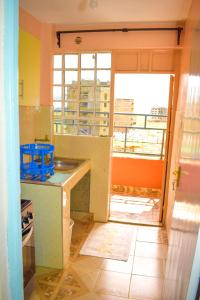 a kitchen being remodeled with a view of a window at Fully furnished one bedroom bnb in thika town jomoko in Thika