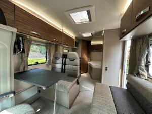 an interior of an rv with a table and chairs at Swift Escape 646 Motorhome in Kirton