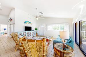 a living room with a couch and a table at Sea Pointe on the Canal in Key Colony Beach