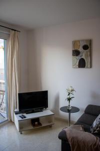 A television and/or entertainment centre at Puesta de Sol Rentals 2BR