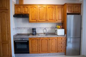 A kitchen or kitchenette at Puesta de Sol Rentals 2BR