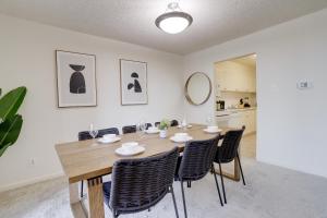 a dining room with a wooden table and chairs at Elegant & charming Apartment in Crystal City in Arlington