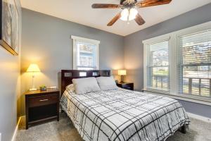 a bedroom with a bed and a ceiling fan at Charming Missouri Home Less Than 1 Mi to Katy Trail! in Pleasant Hill