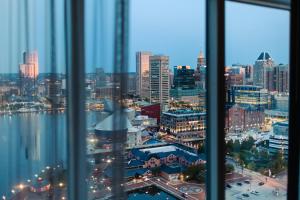 a view of a city skyline from a window at Baltimore Marriott Waterfront in Baltimore