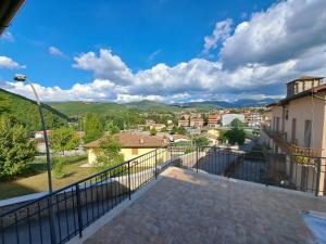 a balcony with a view of a city at Dolce Dimora in Cascia