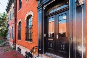 a black door on the side of a brick building at Outdoor Space - Parking - 1st Floor - Walkable in Pittsburgh