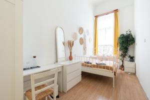 Posteľ alebo postele v izbe v ubytovaní Gellerico Rooms at Rákóczi Square