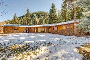 a home in the mountains with snow on the ground at Charming Idaho Springs Retreat on Chicago Creek! in Idaho Springs