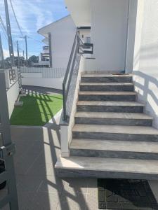 a set of stairs leading to a building at Casa da Silva in Corroios