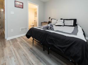 a bedroom with a large bed and a wooden floor at Bobby Knight Hall in Bloomington