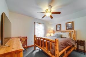 a bedroom with a bed and a ceiling fan at Cozy Greig Getaway - 1 Mi to Brantingham Lake! in Glenfield