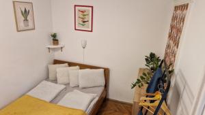 Posteľ alebo postele v izbe v ubytovaní Gellerico Rooms at Horánszky Street