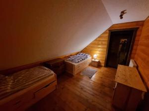 an overhead view of a room with two beds at Zrubík pod Znievom (Log Cabin Zniev) 