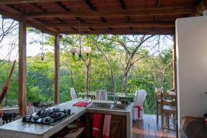 a kitchen with a sink and a counter top at Marbella Retreats Casa Roja in Santa Cruz
