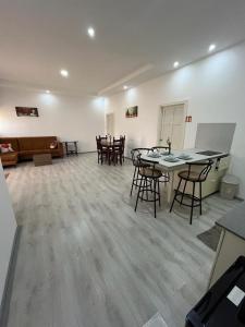 a large room with tables and chairs in it at City Appartementen New Nickerie - 4p in Nieuw Nickerie