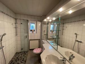 a bathroom with a sink and a toilet at FeWo unter der Kirche in Broggingen